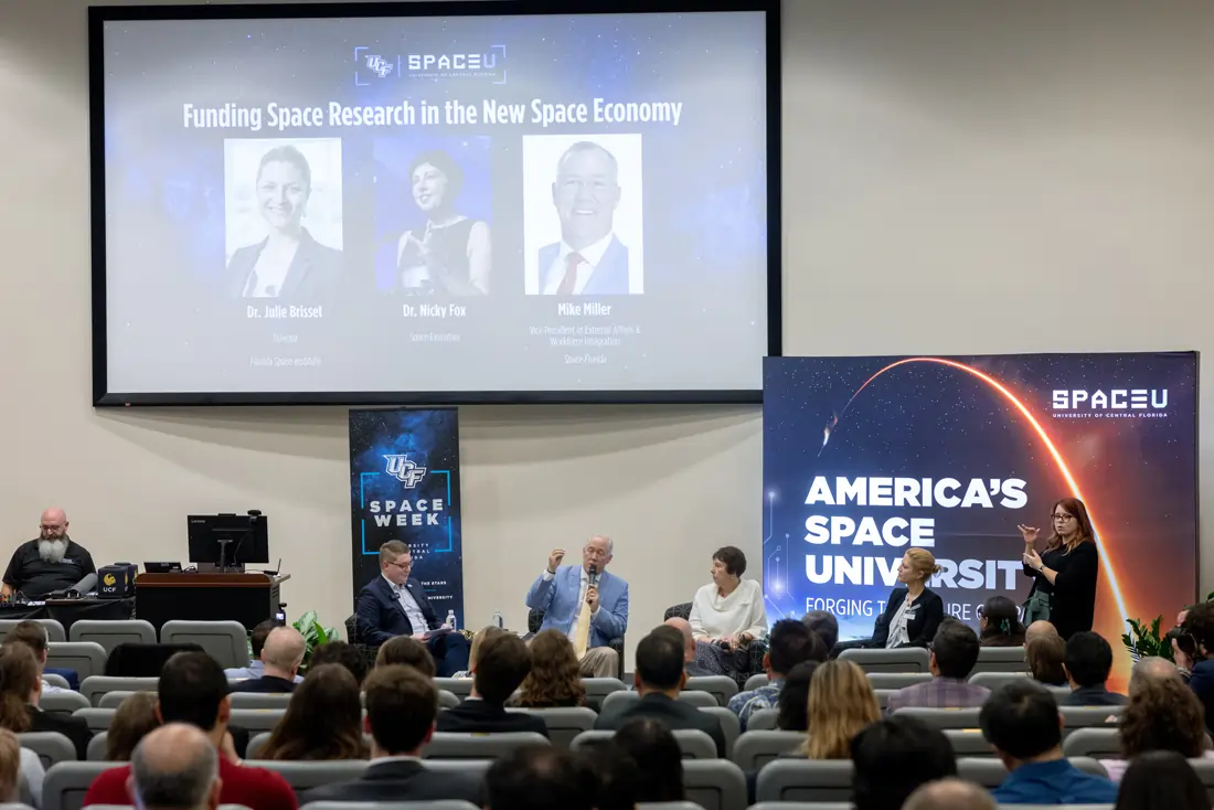 Panelists addressing students and researchers at the SpaceU Symposium.
