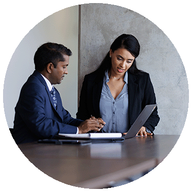 Male and female co-workers discussing gender issues.