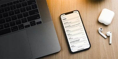 closeup of hands typing on laptop with knights email open on screen