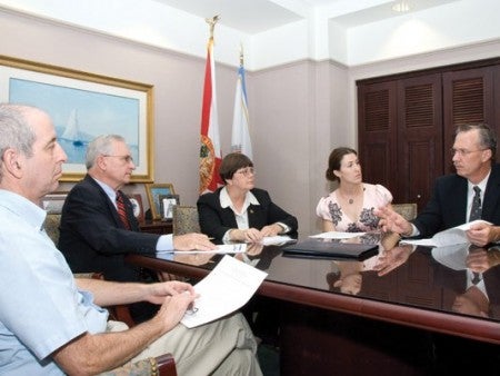 (Left to right) Surette; Lamar; Joyce Dorner, associate dean; Rebekah Hazlett, doctoral student in public affairs; and John Ronnau, director of the School of Social Work, meet in Lamar’s office.