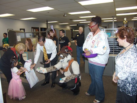 Student Development and Enrollment Services staff in room 282 placed bubbles and Playdoh in the children's goody bags.