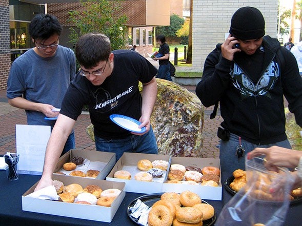 Hungry students partake of free food and Red Bull Energy Drinks provided by the College of Business Administration Alumni Chapter, in conjunction with LarsonAllen and Eleet Technologies.