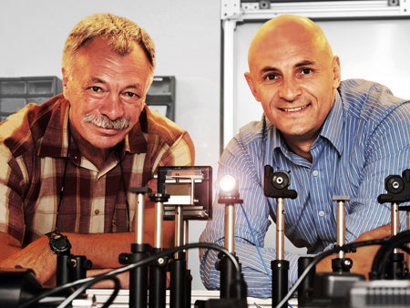 Professor Leon Glebov (left) of the College of Optics and Photonics founded OptiGrate in 1999. The company is now led by President and CEO Alexei Glebov.