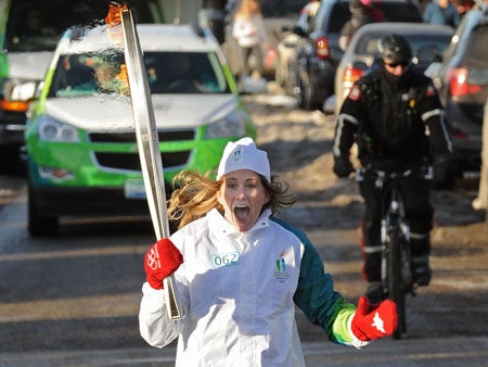 Kaitlyn Chana ran in Calgary on Jan. 19, carrying the Olympic flame on its way to the Opening Ceremonies in Vancouver.