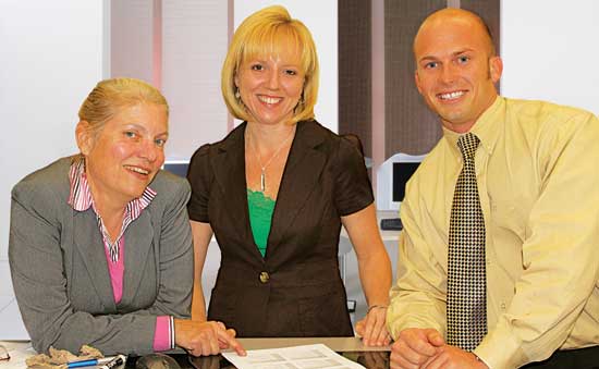 University of Central Florida COHPA graduate student Sheila Schmitt (center) visits with professor Lynn Unruh and fellow student Joe Palermo during a course on Health Economics and Policy. The class meets in person at the Orlando main campus every other week and the rest of the material is administered online.