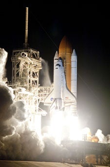 Space shuttle Discovery and its seven-member crew lift off from Kennedy Space Center on April 5. (NASA/Sandra Joseph and Kevin O'Connell)