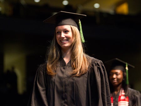 Katherine Olson graduated with a degree in Communication Sciences and Disorders, which she'll use to help people diagnosed with similar hearing impairments.