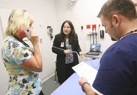 Marisol Romany, manager of cultural development and language services at ORMC, is giving instruction to some of the nurses in the emergency department on how to use video remote thatâs used to bring sign language interpreters to hard of hearing emergency patients. May 12, 2010 Photo by George Skene/Orlando Sentinel B58435015Z.1