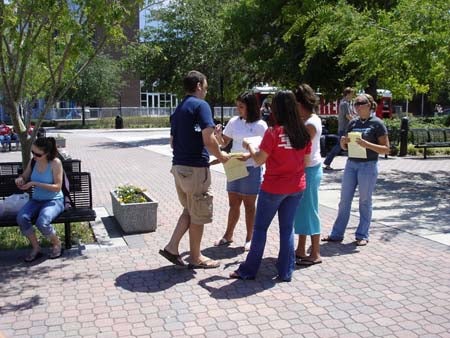 Student volunteers promoting "Party Smart" strategies for safer tailgating.