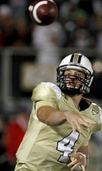 Central Florida quarterback Rob Calabrese (4) throws a pass in relief of injured quarterback Brett Hodges during the third quarter of an NCAA football game against Miami in Orlando, Fla., Saturday, Oct. 17, 2009.(AP Photo/Reinhold Matay)