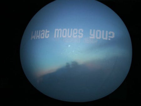 Viewers can text answers to the question, "What moves you?" and see their responses projected onto the sphere.