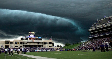 A thunderstorm approaches Bill Snyder Family Stadium during the first quarter of an NCAA college football game between Central Florida and Kansas State Saturday, Sept. 25, 2010 in Manhattan, Kan. Play was suspended in the game due to lightning. (AP Photo/Charlie Riedel)