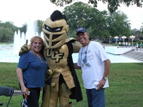 Family members pose for a photo with Knightro.