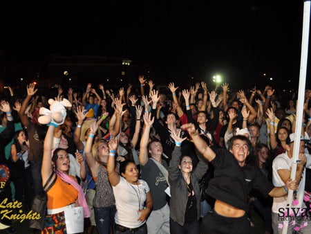 Late Knighters surround the DJ booth as they dance the night away and reach for free "Haunted LK" T-shirts.