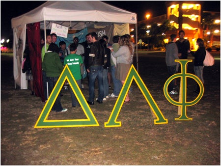 The Delta Lambda Phi tent was packed with new recruits interested in joining their organization.