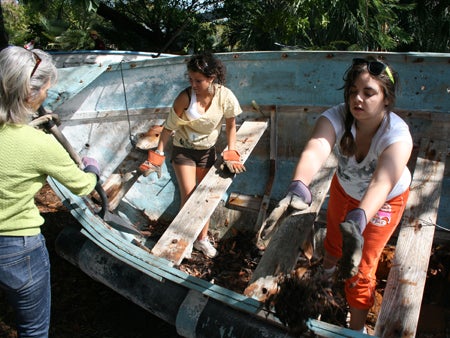 Students and leader retrieve "chug" debris items from water in Key West.