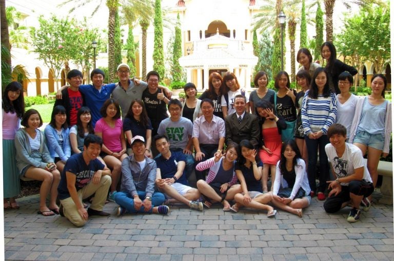 Drs. Youngsoo Choi and James Hogg (center) take a break from class to pose with the enthusiastic Kyung Hee University students.