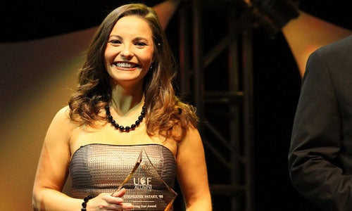 Stephanie Pataky, '05, smiles as she receives her Rising Star Award. Pataky was one of five College of Business Administration alumni honored.