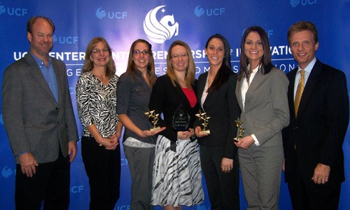 Fall 2011 Cornerstone Competition winners with Jim Balaschak, '86 and '92, and his wife Debbie, ‘88. Dr. Cameron Ford, director of the UCF Center for Entrepreneurship and Innovation, is at far right.