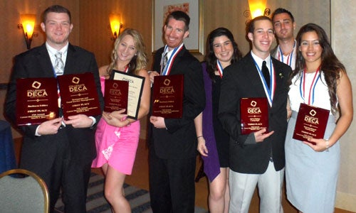 UCF's Collegiate DECA team, winners of several awards at the state competition. Photo (from left to right): Cody McCaughn, Brittany Keating, Jeff McGibbon, Morgan Lawler, Matthew Freindlich, Eddie Rippen, Estefania Martinez
