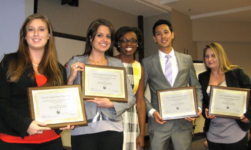 Spring 2012 Capstone Case Competition winners with their instructor, Regina Taylor (center).