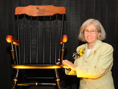 Dr. Diane Wink with her symbolically engraved rocking chair.