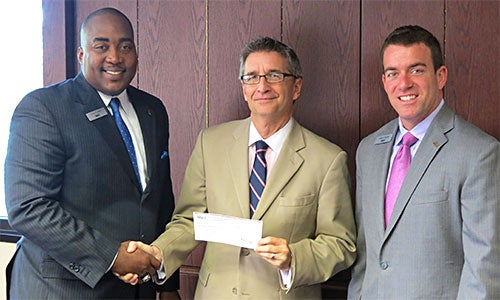 Executives from BB&T present a $100,000 check to the College of Business Administration.
