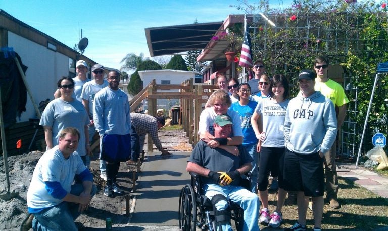 A group of UCF alumni built a wheelchair ramp for a disabled U.S. Army veteran.