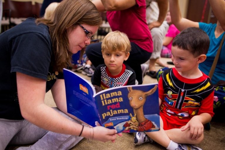 Students volunteer their time to read "Llama Llama Red Pajama" to a group of children from the Creative School for Children at the new Mordgrige Internation Center for Reading.