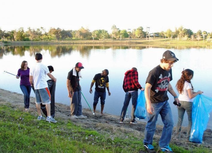 Members of IDEAS for UCF take part in a clean-up of their adopted lake, "Lake IDEAS," located near the Recreation and Wellness Center.