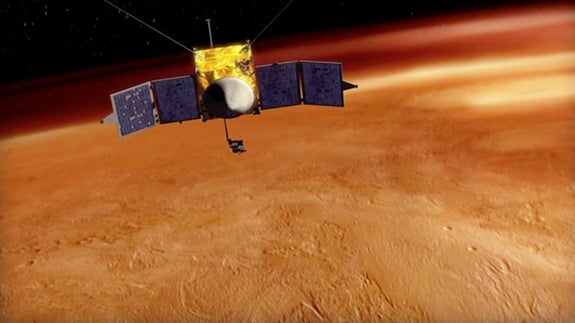 This artist's conception shows the NASA's MAVEN spacecraft orbiting Mars.