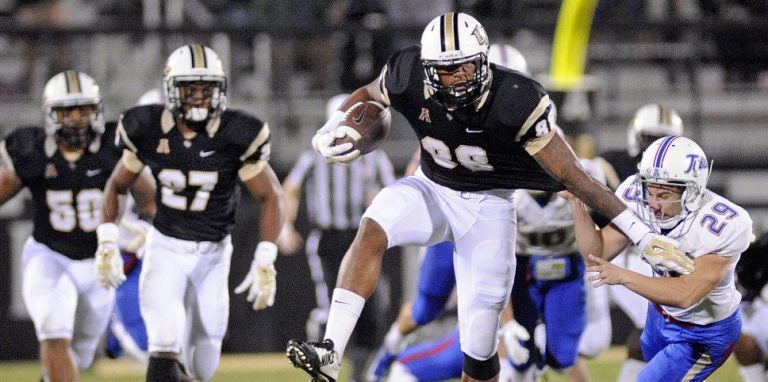 Nov 14, 2014; Orlando, FL, USA; UCF Knights wide receiver Jordan Akins (88) breaks the tackle of Tulsa Golden Hurricane place kicker Carl Salazar (29) during a kickoff return at Bright House Networks Stadium. Mandatory Credit: David Manning-USA TODAY Sports