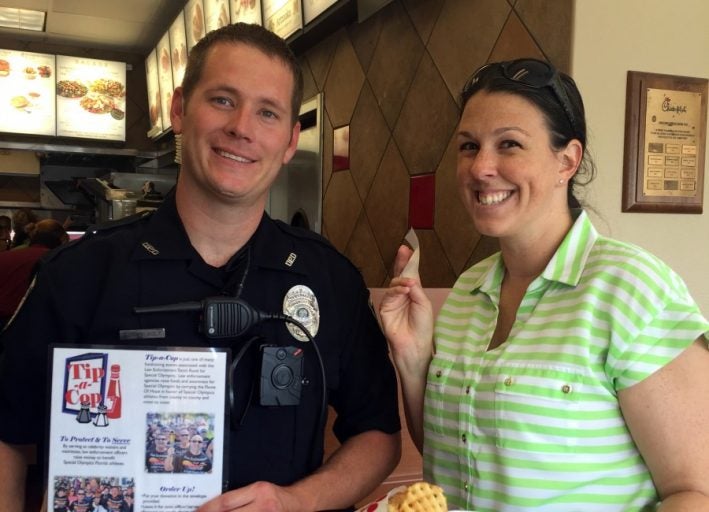 Ofc. Adam Casebolt and Det. Amber Abud served Chick-fil-A customers to help raise awareness and money for the Special Olympics.