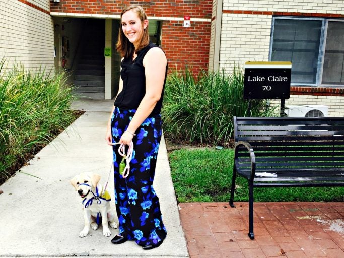 Morgan Bell is the first UCF student to have a service dog-in-training live with her in campus housing.
