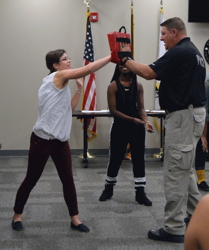 UCF student Bridget Weber demonstrates a punching exercise with UCFPD Ofc. Peter Stephens.