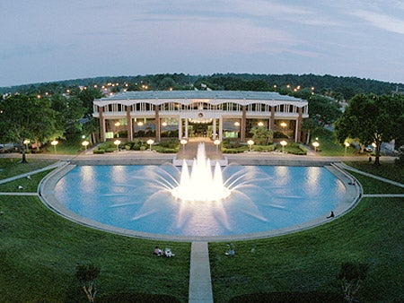 ucf reflecting pond, aerial view, fountain lit up, in front of millican hall