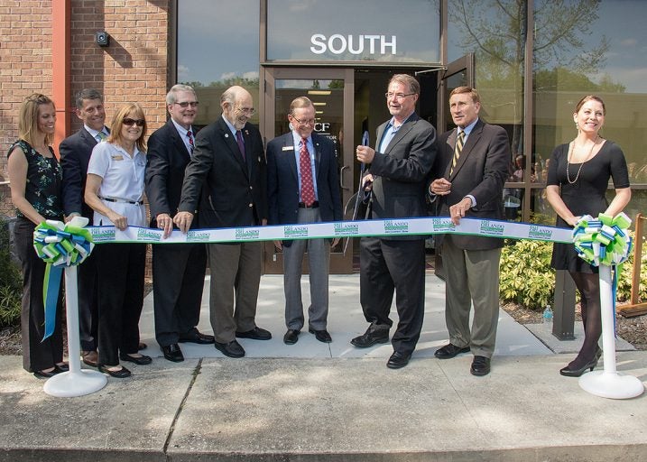 UCF representatives, local economic development and legislative officials cut the ribbon to celebrate the renovation and expansion of the Research Park incubator.