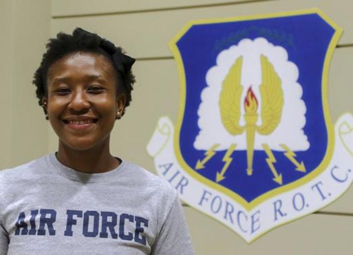 Kamillia Crawford in front of air force rotc banner