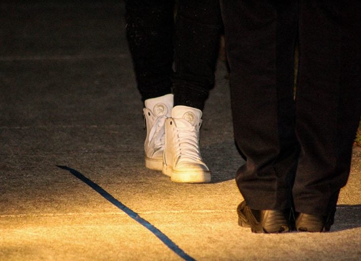 photo of police feet and dui suspect feet