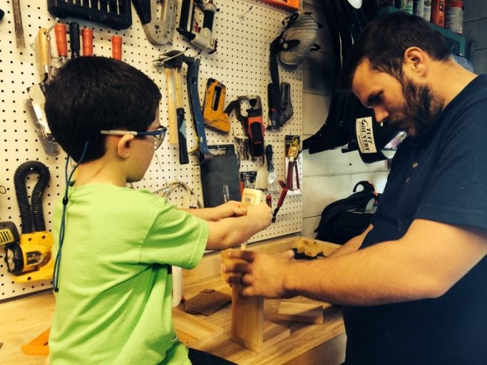 russell woodworking with his foster son