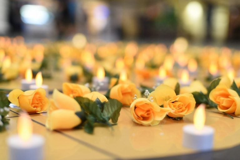 Flowers and candles covered the Pegasus seal in the Student Union Monday in remembrance of the Pulse shooting victims.