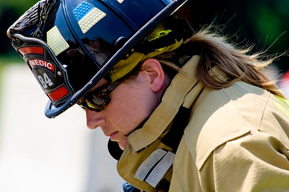 Female Paramedic leaning over