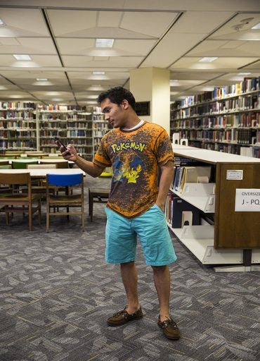 Spotted at the John C. Hitt Library: Christiane Ortiz-Hernandez playing Pokémon Go.