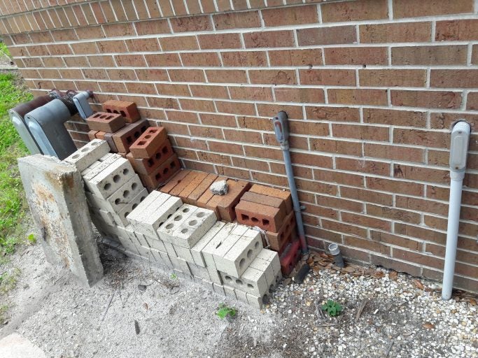 discarded pallets or other debris behind campus building