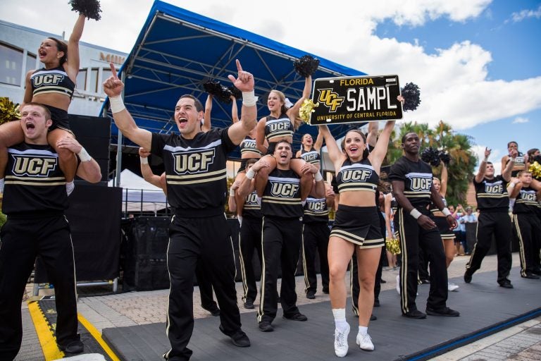 #KnightYourRide: male and female cheerleaders celebrating