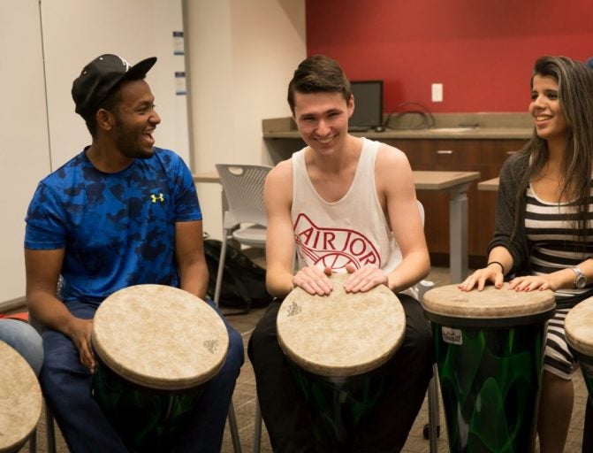 students in drum circle in classroom