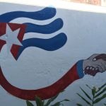 A wall mural in Cuba promoting partnerships. (Photo by Oliver McSurley)