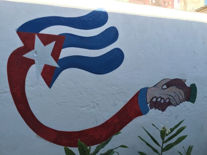 A wall mural in Cuba promoting partnerships. (Photo by Oliver McSurley)
