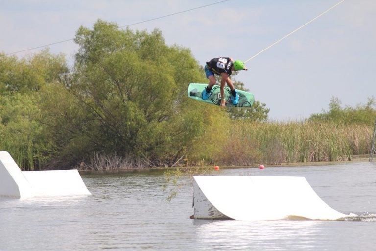 UCF Wakeboarding Team doing trick off ramp