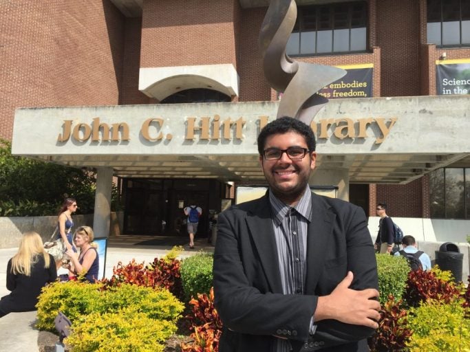 steven s standing in front of john c hitt library on ucf campus